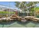 Spa with small waterfall and surrounded by green plants at 10229 Waterside Oaks Dr, Tampa, FL 33647
