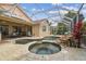 Screened in pool area with a spa and travertine tile at 10229 Waterside Oaks Dr, Tampa, FL 33647