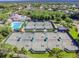 Overhead shot of a well-maintained tennis court complex surrounded by trees and greenery at 10229 Waterside Oaks Dr, Tampa, FL 33647