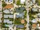 Overhead view of closely arranged residential homes with backyard pools and manicured lawns along a quiet street at 106 13Th Ave, St Pete Beach, FL 33706