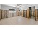 Spacious bedroom with tile flooring and ceiling fan, currently undergoing renovation at 106 13Th Ave, St Pete Beach, FL 33706