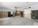 Bright kitchen being renovated, featuring a ceiling fan and stainless steel refrigerator, offering a spacious layout at 106 13Th Ave, St Pete Beach, FL 33706