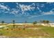 Coastal scene featuring lush dunes covered in tropical palm trees and beautiful beach at 1070 Eldorado Ave, Clearwater Beach, FL 33767