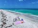 Beach picnic scene with a beach bike and accessories on the powdery white sand at 1070 Eldorado Ave, Clearwater Beach, FL 33767