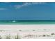 Tranquil beach scene with a motorboat gliding along the turquoise water at 1070 Eldorado Ave, Clearwater Beach, FL 33767