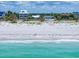 Beachfront homes line the shore with crystal blue water and a pristine sandy beach at 1070 Eldorado Ave, Clearwater Beach, FL 33767