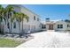Spacious two-story home featuring an attached two-car garage and a driveway at 1070 Eldorado Ave, Clearwater Beach, FL 33767