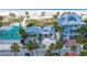 Beautiful exterior of a beach house with a metal roof and lush landscaping at 1070 Eldorado Ave, Clearwater Beach, FL 33767
