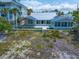 Charming beachfront property, boasting a screened-in porch and an inviting open patio at 1070 Eldorado Ave, Clearwater Beach, FL 33767
