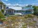 Charming beach house with a screened-in porch, offering great outdoor living at 1070 Eldorado Ave, Clearwater Beach, FL 33767