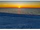 Scenic ocean view showcasing a radiant sunrise, with the sun reflecting off the tranquil, expansive sea at 1070 Eldorado Ave, Clearwater Beach, FL 33767