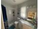 Bathroom featuring a glass shower, white subway tiles, and a granite countertop at 11010 Salt Tree Dr, Port Richey, FL 34668