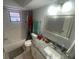 Bathroom featuring a shower-tub combination, granite countertop, and decorative mirror at 11010 Salt Tree Dr, Port Richey, FL 34668