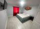 Cozy bedroom with tile floors, a ceiling fan, and a queen-sized bed at 11010 Salt Tree Dr, Port Richey, FL 34668
