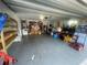 Spacious garage with ample storage space for vehicles and other items at 11010 Salt Tree Dr, Port Richey, FL 34668