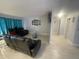 Spacious living room with tile flooring and modern furnishings at 11010 Salt Tree Dr, Port Richey, FL 34668