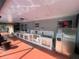 A fully equipped outdoor kitchen area with stainless steel appliances and plenty of counter space at 11010 Salt Tree Dr, Port Richey, FL 34668