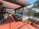 Large screened patio with a view of the pool and backyard at 11010 Salt Tree Dr, Port Richey, FL 34668