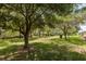 Expansive backyard featuring mature trees offering ample shade and privacy at 1142 Sweet Jasmine Dr, Trinity, FL 34655