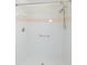 Stand-up shower features white tiles with a pink accent tile running horizontally at 1142 Sweet Jasmine Dr, Trinity, FL 34655