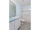 Bathroom features a single vanity, tiled floors, and a bathtub-shower combo at 1142 Sweet Jasmine Dr, Trinity, FL 34655