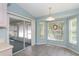 Breakfast nook featuring a sliding glass door, large windows, and tile flooring at 1142 Sweet Jasmine Dr, Trinity, FL 34655