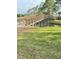 A charming wooden bridge over a calm pond, enhancing the natural beauty of the community at 1142 Sweet Jasmine Dr, Trinity, FL 34655
