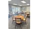 Cozy dining area with tables and chairs for residents at this senior living community at 1142 Sweet Jasmine Dr, Trinity, FL 34655