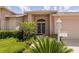 Inviting front porch with double doors, brick columns, and manicured landscaping at 1142 Sweet Jasmine Dr, Trinity, FL 34655