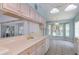 Kitchen featuring stylish cabinets, modern countertops and a view of a bright breakfast nook at 1142 Sweet Jasmine Dr, Trinity, FL 34655