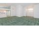 Open-concept living room, with view of entry way and kitchen at 1142 Sweet Jasmine Dr, Trinity, FL 34655
