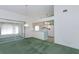 Bright living room featuring sliding glass doors and an open view of the adjacent kitchen area at 1142 Sweet Jasmine Dr, Trinity, FL 34655