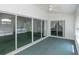 Spacious sunroom with sliding glass doors offering seamless indoor-outdoor living at 1142 Sweet Jasmine Dr, Trinity, FL 34655