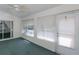 Inviting sunroom with large windows, ceiling fan, and easy access to the outdoors at 1142 Sweet Jasmine Dr, Trinity, FL 34655