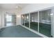 Open sunroom showcasing sliding glass doors and access to other areas of the home at 1142 Sweet Jasmine Dr, Trinity, FL 34655