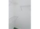 White walk-in closet features coated metal shelving providing ample storage space at 1142 Sweet Jasmine Dr, Trinity, FL 34655