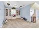 Spacious bonus room with built-in bookshelves and light blue walls at 13533 Bay Lake Ln, Tampa, FL 33618