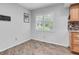 Cozy breakfast nook with wood-look floors and window overlooking the exterior at 13533 Bay Lake Ln, Tampa, FL 33618