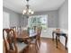 Elegant dining room with classic chandelier and large window at 13533 Bay Lake Ln, Tampa, FL 33618