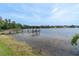 Scenic view of the dock, highlighting its peaceful setting and connection to the lake at 13533 Bay Lake Ln, Tampa, FL 33618