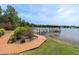 A boardwalk leads to a covered dock, offering a serene escape and direct access to the lake at 13533 Bay Lake Ln, Tampa, FL 33618