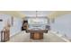 Spacious game room featuring a pool table, arcade game, pendant lighting and bright windows at 13533 Bay Lake Ln, Tampa, FL 33618