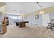 Spacious game room featuring a pool table, arcade game, and pendant lighting at 13533 Bay Lake Ln, Tampa, FL 33618