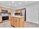 Updated kitchen with granite island, stainless appliances and tile floors at 13533 Bay Lake Ln, Tampa, FL 33618