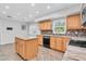Bright kitchen with granite countertops, mosaic backsplash and modern appliances at 13533 Bay Lake Ln, Tampa, FL 33618