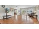 Inviting living room with hardwood floors, slider doors and view of pool at 13533 Bay Lake Ln, Tampa, FL 33618