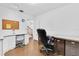 Office space featuring two desks, cabinets and an office chair at 13533 Bay Lake Ln, Tampa, FL 33618