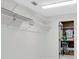 Walk-in closet with wire shelving units for optimal storage and organization at 13533 Bay Lake Ln, Tampa, FL 33618