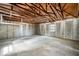 Unfinished basement with concrete walls and floors, offering potential for customization at 1400 23Rd S Ave, St Petersburg, FL 33705