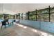 Enclosed porch featuring seating, painted concrete floors, and views of the yard at 1400 23Rd S Ave, St Petersburg, FL 33705